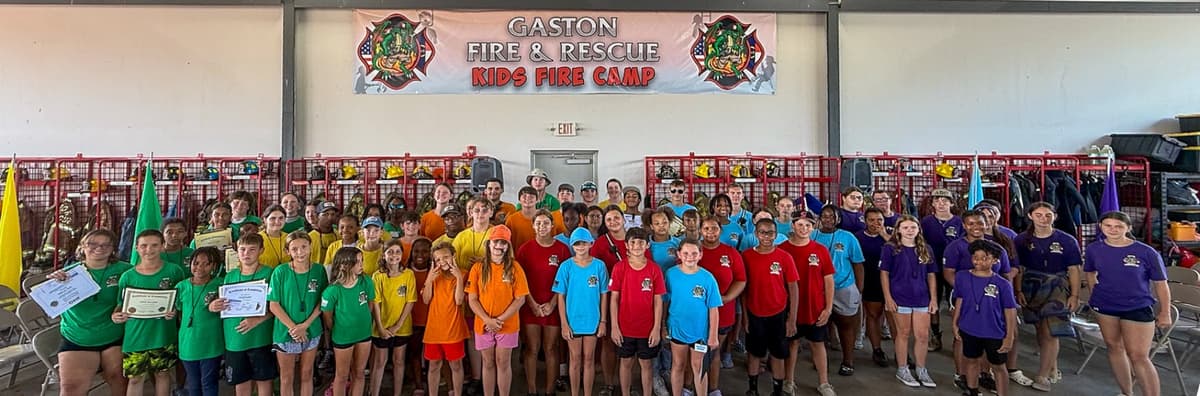 Kids Fire Camp participants training with Gaston Fire & Rescue firefighters